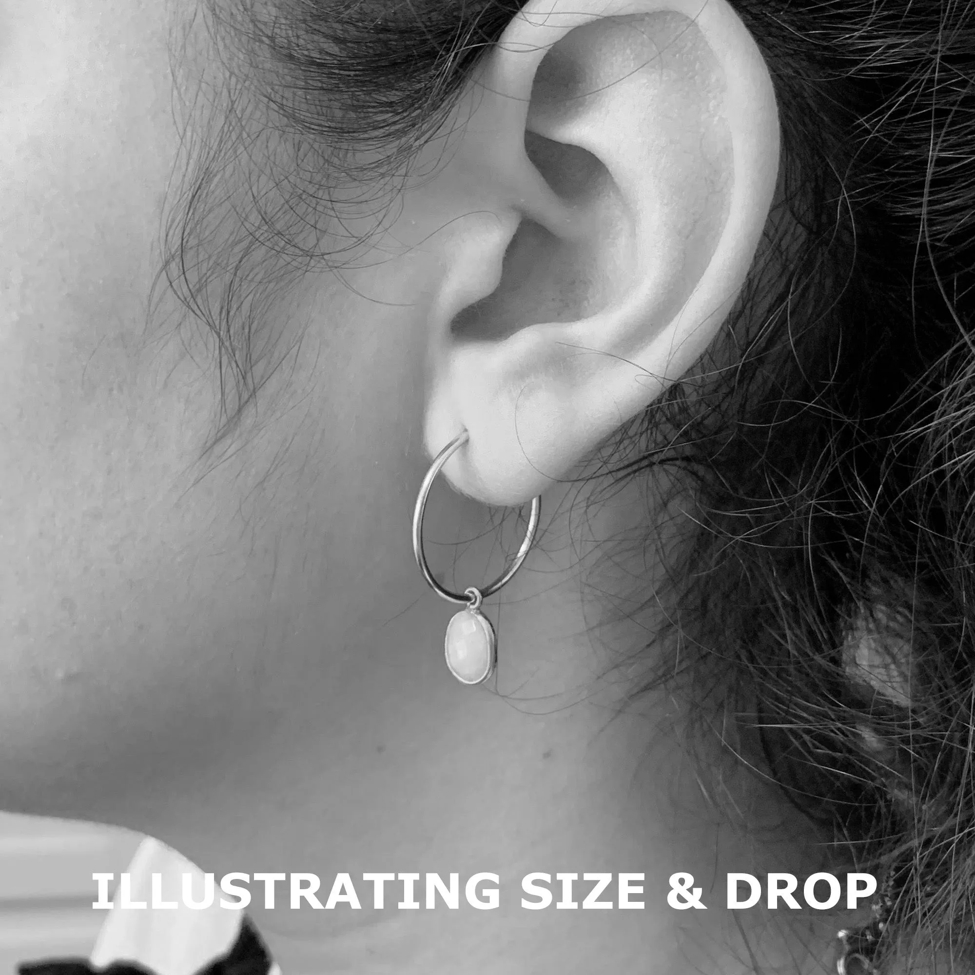 Gemstone earrings with clear quartz (rock crystal) oval crystal drops on gold medium hoops